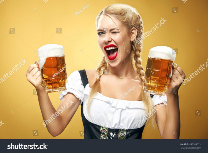 stock-photo-young-sexy-oktoberfest-waitress-wearing-a-traditional-bavarian-dress-serving-big-beer-mugs-on-485303071.jpg